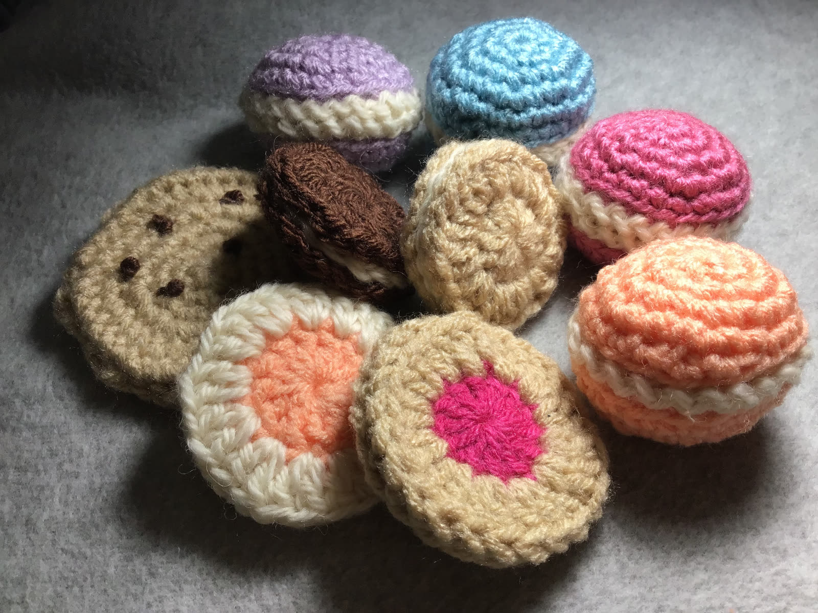 Assortment of crocheted cookies and sandwich cookies